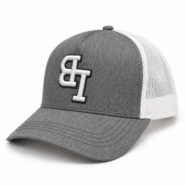 Late Brake grey and white mesh trucker hat with an embroidered LB monogram on a white background.