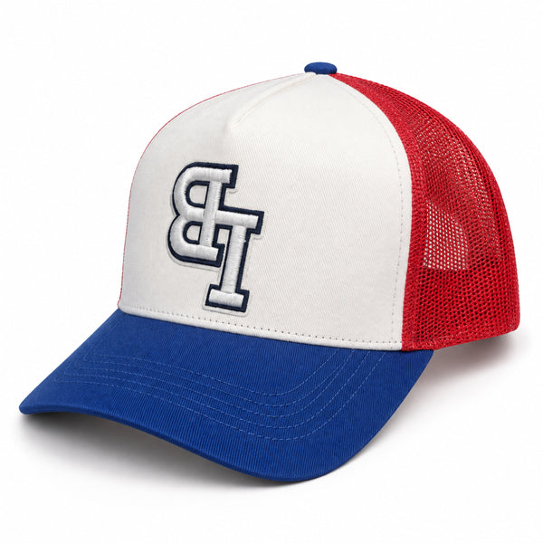 Late Brake red, white and blue trucker hat with an embroidered LB monogram on a white background.
